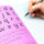 Handwriting Practice Book With A Pen Writing In The Silvine SEN Handwriting Book Blue Tinted Papers For Classrooms On A White Background