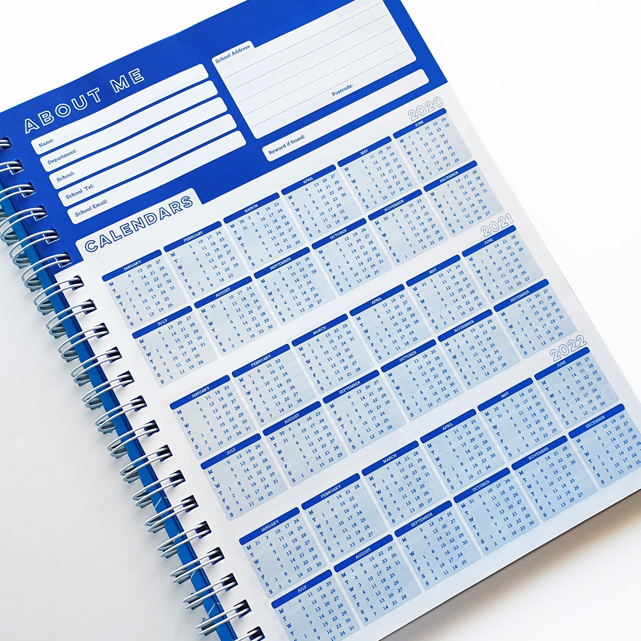 Teachers Planner Open On Calendar Planner Page, In A Blue & White Design On A White Background