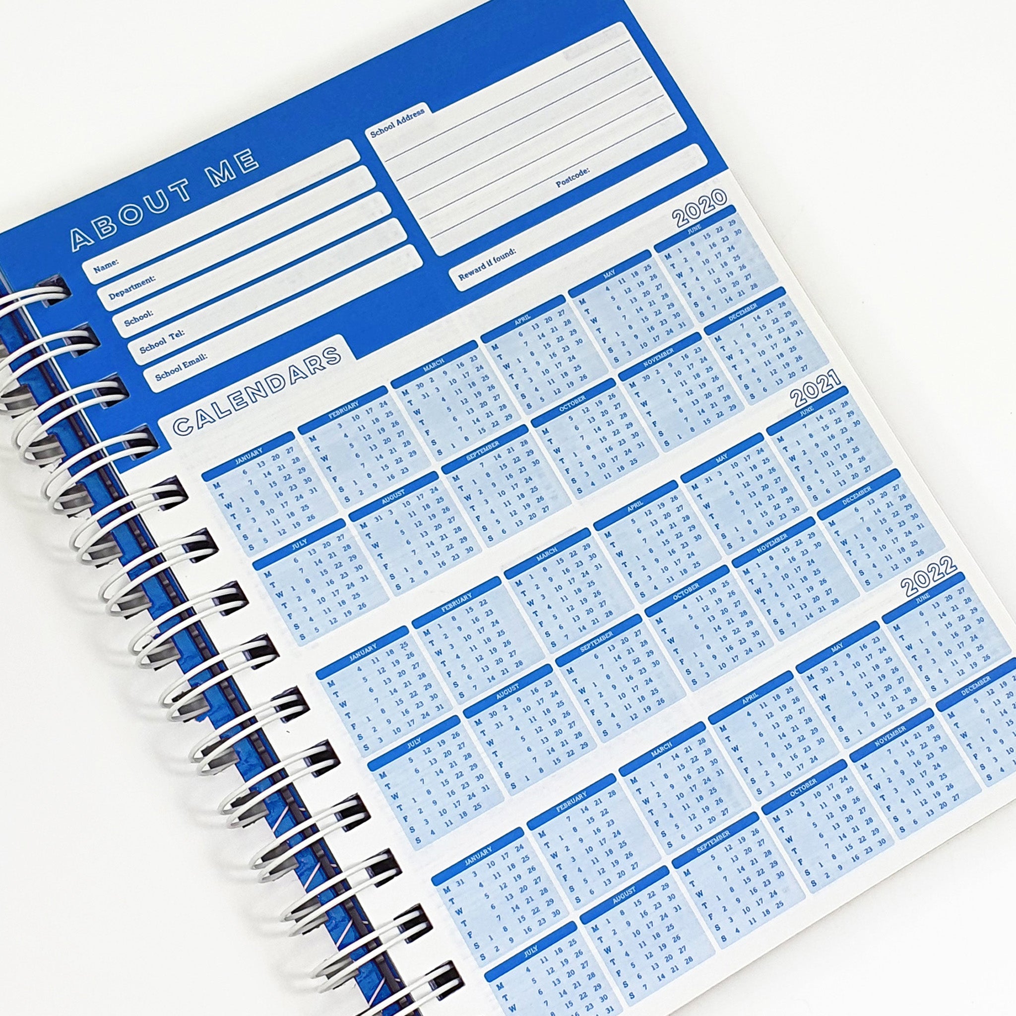 Teachers Planner Open On Calendar Planner Page, In A Blue & White Design On A White Background