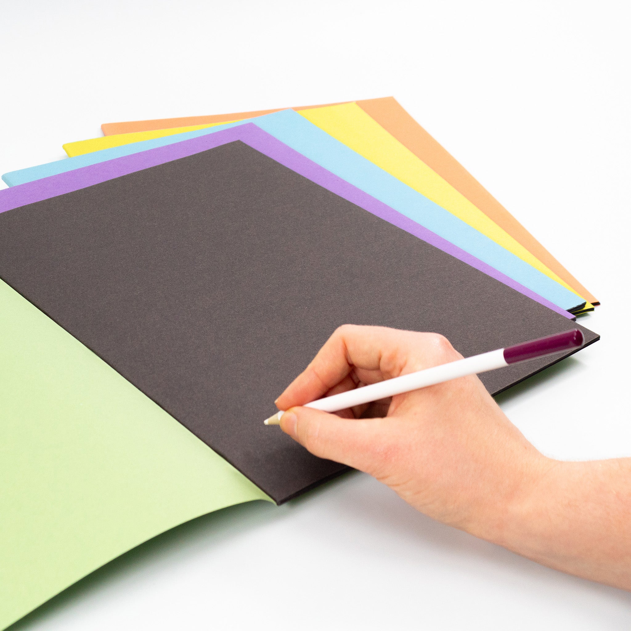 25 Pack Of Assorted Covered Scrapbooks With Black Sugar Paper Inners On A White Background