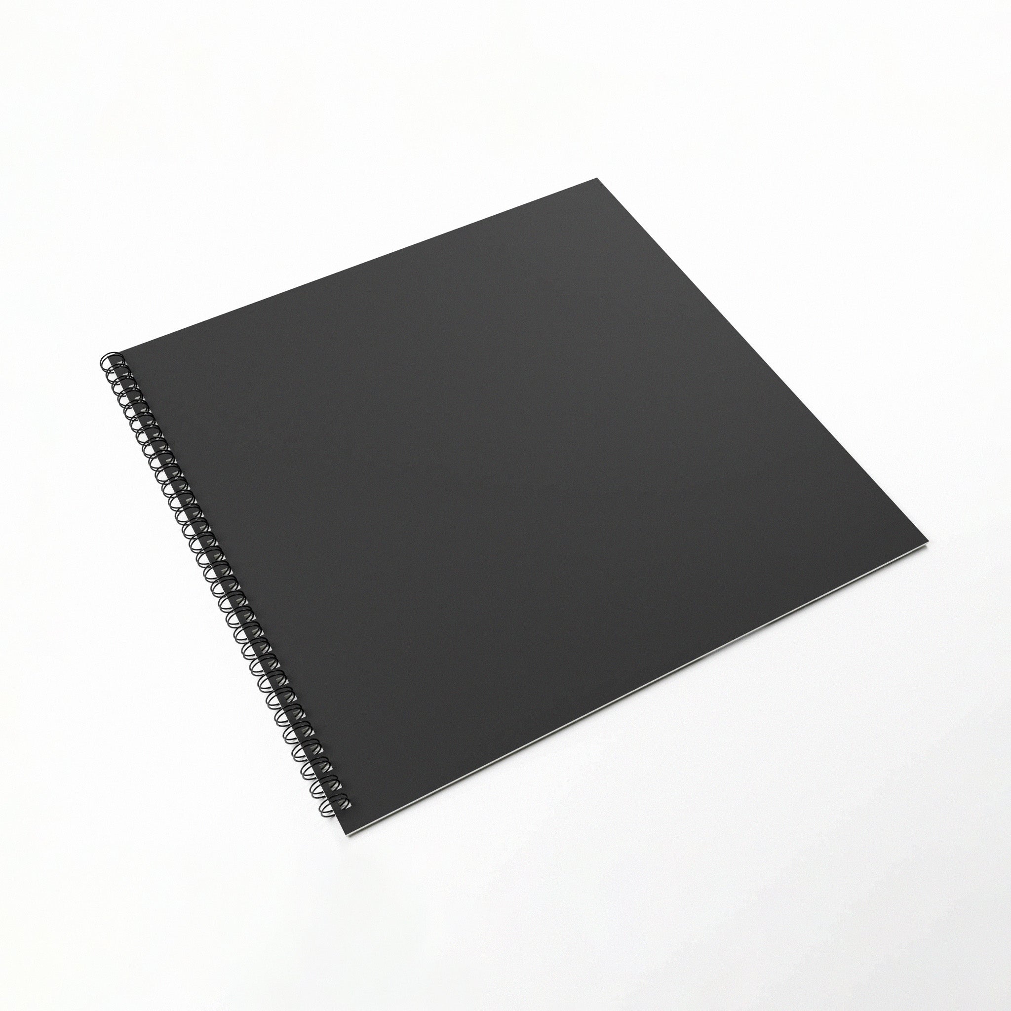 Black Spiral-Bound Classroom Floor Sketchbook On A White Background