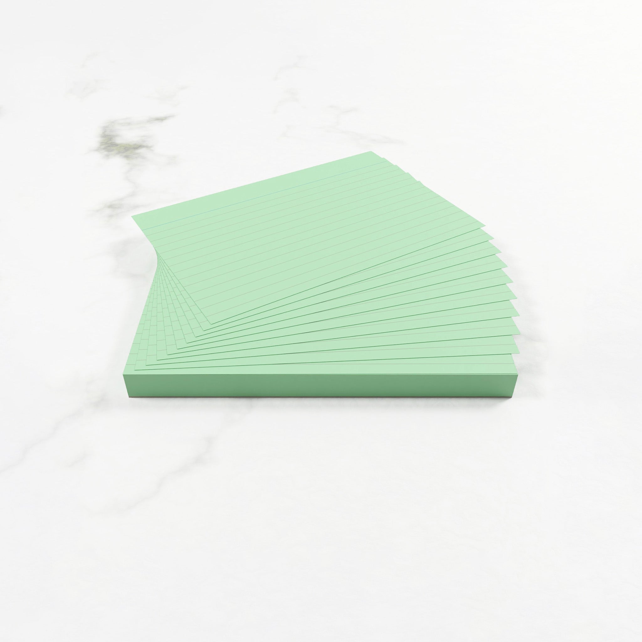 Open Pack Of Lined Silvine Green Tinted Paper Revision Cards On A White Background