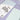 Two Silvine Blue Tinted Paper Notebooks, One Closed & One Open Displaying The Lined Paper On A Purple Gingham Background